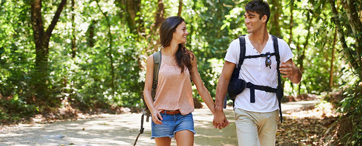 Happy, Smiling Couple Enjoying a Walk in the Woods